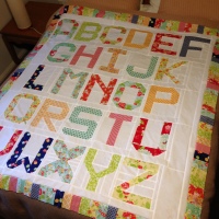 At last!  Spell it with Moda quilt top is complete